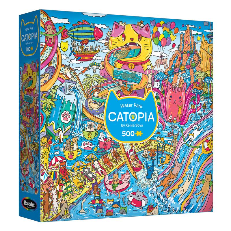 The ROSEART-CATOPIA-WATER PARK-500 PIECE JIGSAW PUZZLE features cartoon cats at a vibrant water park with slides, pools, and fun attractions. The box is colorful and contains 500 puzzle pieces.
