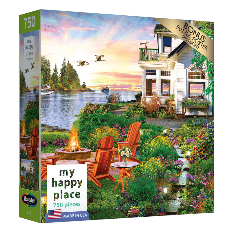 A RoseArt - My Happy Place - Harbor House - 750 Piece Jigsaw Puzzle box displaying an image of a scenic lakeside house with a garden, two red chairs by a fire pit, and flying geese at sunset. The box mentions a bonus puzzle poster included.