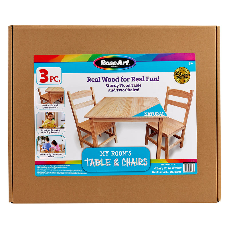 Box containing a RoseArt "My Room's Table & Chairs: Stylish Real Wood Furniture for Creative Spaces" set, including a wooden table and two wooden chairs. The package highlights its natural wood, easy assembly, and suitability for ages 3 and up.