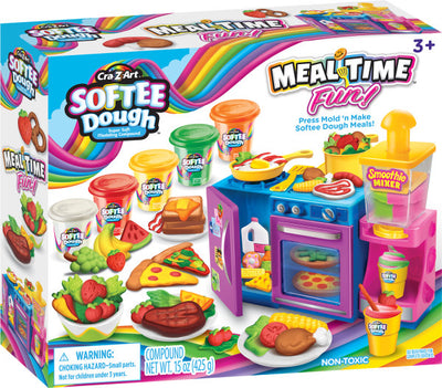 Box of Softee Dough Mealtime toy set with kitchen appliances, food molds, and colorful dough containers. Includes pizza, burgers, and smoothie items. Suitable for ages 3 and up.
