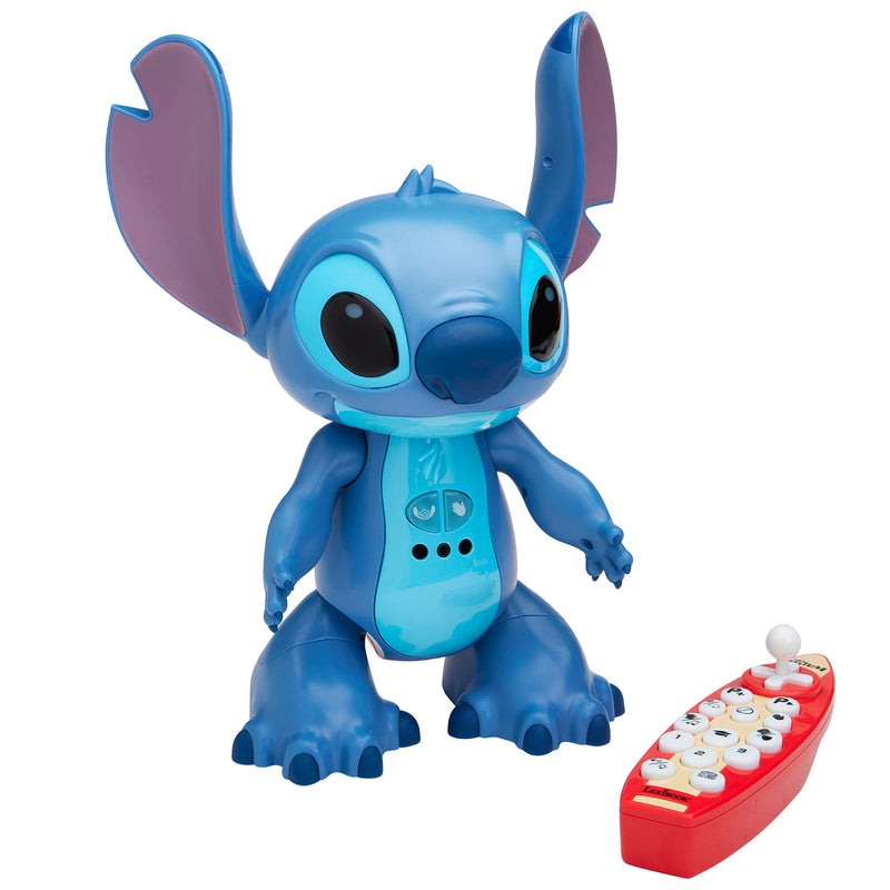 A blue Stitch toy figure with large ears stands next to a red electronic remote control featuring white buttons.