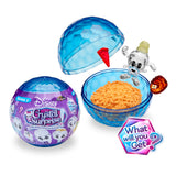 The Disney Crystal Surprise Series 2 toy set features a blue spherical container, orange sand, and a clear figurine. Packaging shows text and a "What will you get?" graphic.