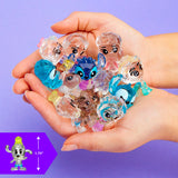 A pair of hands holds several small, translucent Disney Crystal Surprise Series 2 figurines with large eyes. An inset on a purple background displays a single figurine's height as 1.75 inches.