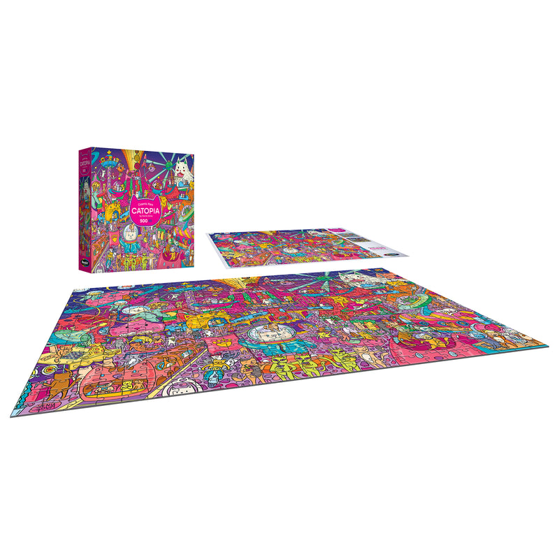 The ROSEART-CATOPIA-COSMIC PARK 500-piece jigsaw puzzle features a vibrant cartoon cat city scene, shown finished next to its box and reference image.