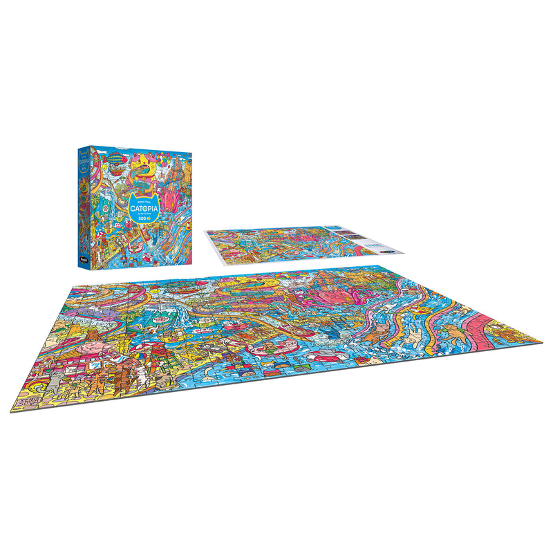 The completed ROSEART-CATOPIA-WATER PARK-500 PIECE JIGSAW PUZZLE, featuring colorful city landmarks like a water park, is displayed next to its box and the unassembled puzzle.