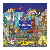 Vibrant cityscape with cats, buildings, and taxis surrounds the "CATOPIA" logo and 500-piece count. The ROSEART-CATOPIA-AMERICAT-500 PIECE JIGSAW PUZZLE is a playful pick for cat lovers and urban explorers!.