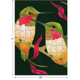 The ROSEART-GIFT SET-BIRDS, BUTTERFLIES AND A CRAB features two birds facing each other on pink-leaved branches with butterflies nearby, beautifully illustrated as a completed 10 by 7 inch jigsaw puzzle.