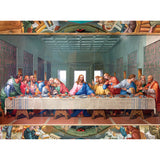 A detailed painting depicts a long table with thirteen individuals seated on one side, with a central figure surrounded by others engaging in various interactions, consuming a meal in the RoseArt - Inspirations - Last Supper - 1000 Piece Jigsaw Puzzle.