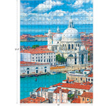The ROSEART-KODAK Camera to Canvas Venice 500-piece jigsaw puzzle shows red-roofed buildings, blue water, and Santa Maria della Salute church; completed image measures 21.5" x 15".