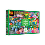 The ROSEART-KODAK CAMERA TO CANVAS 500-piece jigsaw puzzle features colorful flowers in buckets, accented by a green border and classic KODAK branding.