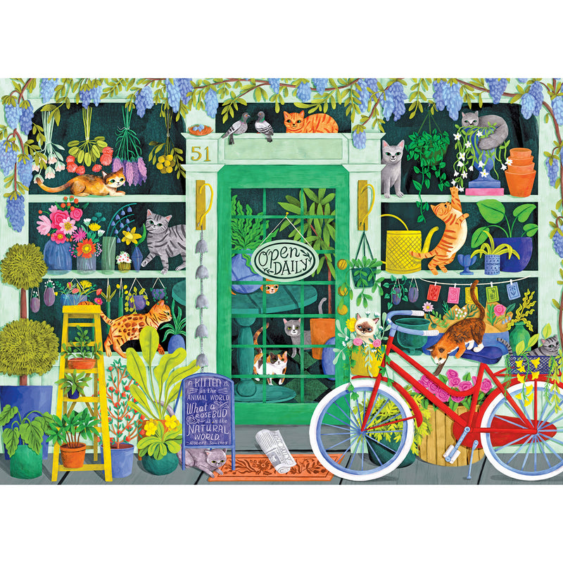 A green storefront adorned with numerous plants, flowers, and cats in various positions. A red bicycle with a basket is parked in front, and a sign reading "Open Daily" hangs on the door – it's the scene featured in the RoseArt-Soft Touch-Cat Flowers-1000 Piece Jigsaw Puzzle.