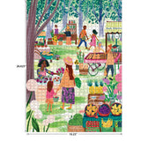 An outdoor farmers market with various stalls selling produce, flowers, and handmade items. People are shopping and interacting amidst colorful displays under a canopy of trees is beautifully captured in the RoseArt-Soft Touch-Farmer's Market-1000 Piece Jigsaw Puzzle.