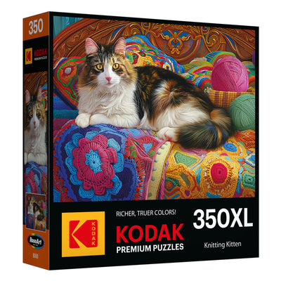 The "Knitting Kitten" jigsaw puzzle from the ROSEART KODAK Premium collection features a colorful cat on knitted blankets with yarn balls. This 300-piece puzzle promises hours of delightful fun.
