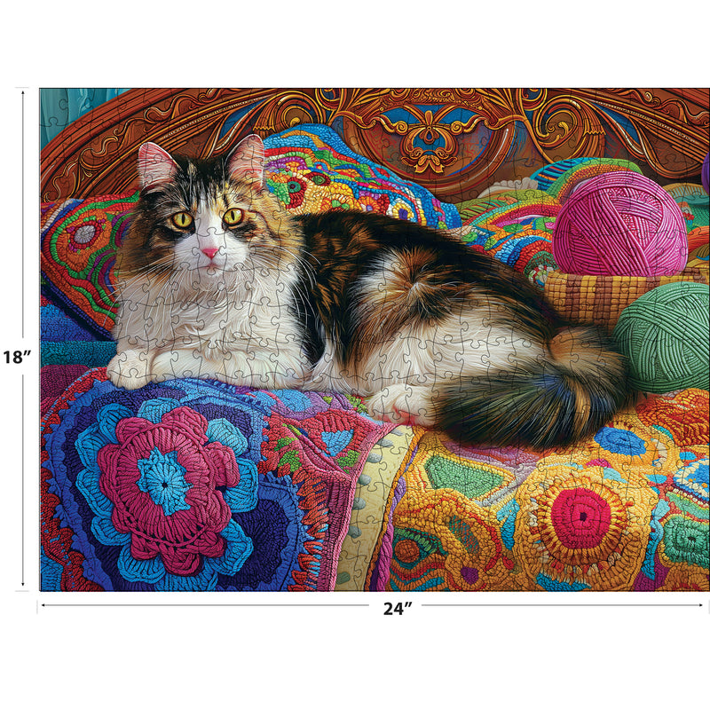 The ROSEART - KODAK PREMIUM 300-piece jigsaw puzzle features a multicolored knitting kitten on a vibrant crochet blanket with yarn balls, measuring 18x24 inches.