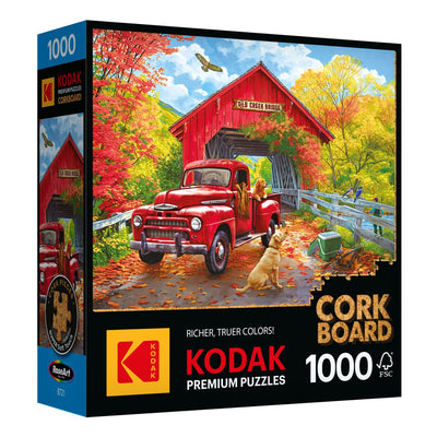 Experience the Cra-Z-Art - RoseArt - Kodak Cork jigsaw puzzle, depicting a picturesque autumn scene with a red vintage truck near an old creek bridge, surrounded by trees and a loyal dog sitting nearby. This intricate puzzle contains 1000 pieces.