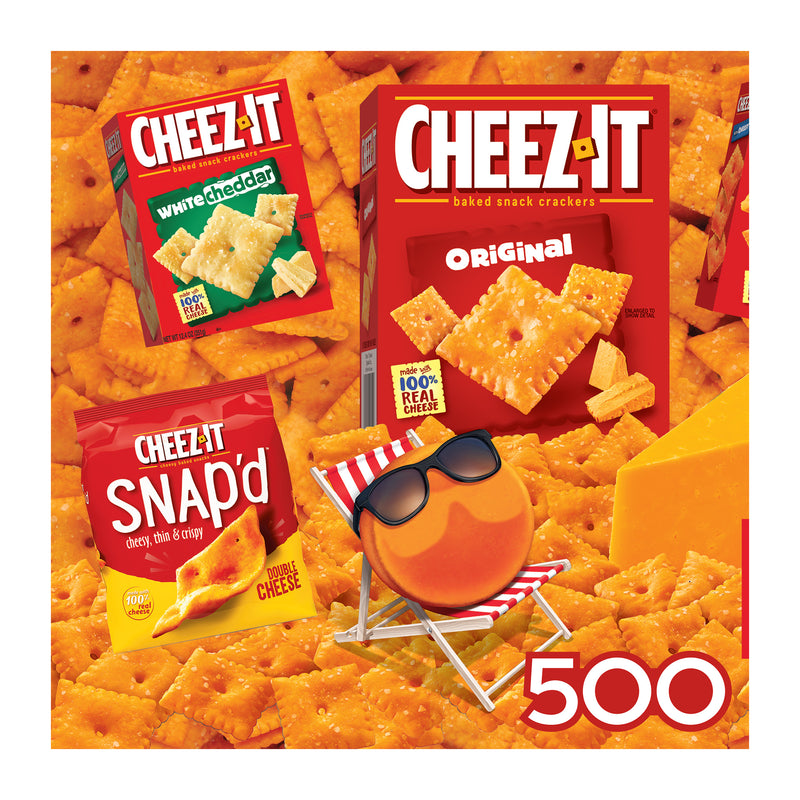 The ROSEART Snack Assortment 500-piece jigsaw puzzle features Cheez-It crackers in Original and Snap'd packs, complemented by a cheese wedge and a cartoon cheese circle on a deck chair, offering a delightful and fun cheesy experience.