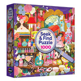 The ROSEART SEEK & FIND Paris Perfume Shop 1000-piece jigsaw puzzle features an illustrated vanity scene with flowers, perfume bottles, objects, and a magnifying glass on the box front.