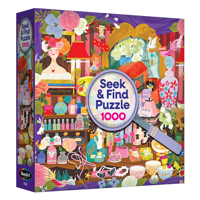 The ROSEART SEEK & FIND Paris Perfume Shop 1000-piece jigsaw puzzle features an illustrated vanity scene with flowers, perfume bottles, objects, and a magnifying glass on the box front.