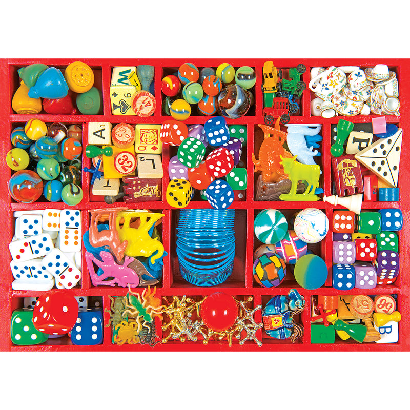 A red tray segmented into compartments, each holding an assortment of colorful small toys, dice, game pieces, and trinkets, RoseArt - Kodak Premium - Vintage Toy Box - 3000 Piece Jigsaw Puzzle.