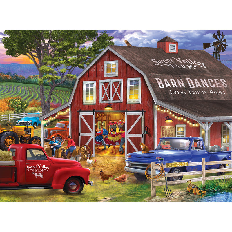 A lively barn dance is in progress at Sweet Valley Farm, with people dancing inside a red barn, classic trucks parked outside, farm animals around, and a scenic countryside in the background. The scene is beautifully captured in the RoseArt - Chris Bigelow - The Barn Dance - 1000 Piece Jigsaw Puzzle.