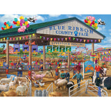 A colorful scene of a county fair showcasing livestock judging. People are observing various animals, including sheep and cows. The background features fair attractions and balloon decorations is depicted in the **RoseArt - Chris Bigelow - Blue Ribbon Country Fair - 1000 Piece Jigsaw Puzzle**.