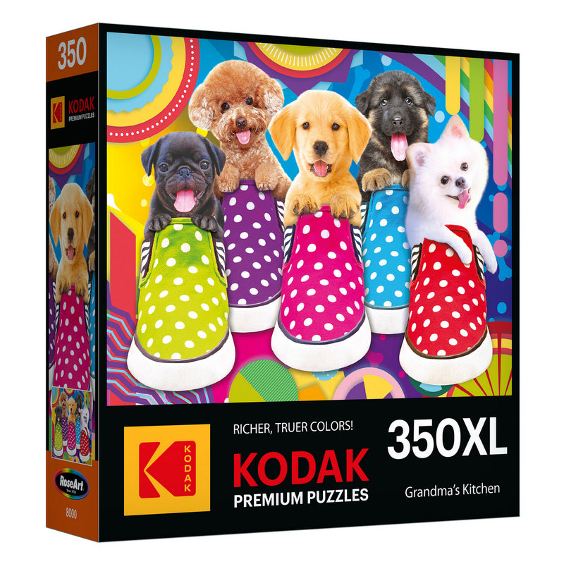 Colorful RoseArt-Kodak Premium-Puppy Socks-350 Piece Jigsaw Puzzle featuring five puppies in polka dot slippers against a vibrant background, titled "Grandma's Kitchen.