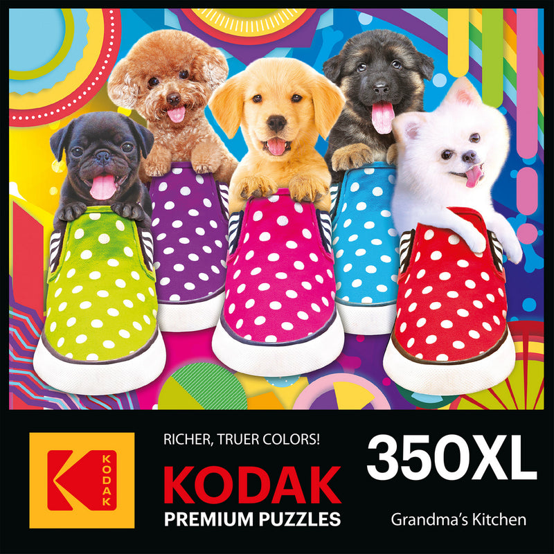 Colorful RoseArt-Kodak Premium-Puppy Socks-350 Piece Jigsaw Puzzle box showing five puppies of various breeds sitting in polka-dotted shoes against a vibrant background. Text includes "Kodak Premium Puzzles," "350XL," and "Grandma's Kitchen.