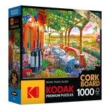 RoseArt - Kodak Cork - Wine Country - 1000 Piece Jigsaw Puzzle box featuring an image of a Mediterranean-style outdoor cafe with wine bottles and scenic vineyard background. The puzzle has 1000 pieces and includes a bonus poster.
