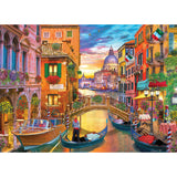 The ROSEART - KODAK PREMIUM - GRAND CANAL VENICE - 1000 PIECE JIGSAW PUZZLE captures the colorful spirit of Venice’s Grand Canal at sunset, with gondolas, vibrant buildings, a bridge, and outdoor dining. It's perfect for reliving a Kodak moment or enjoying as a delightful puzzle.