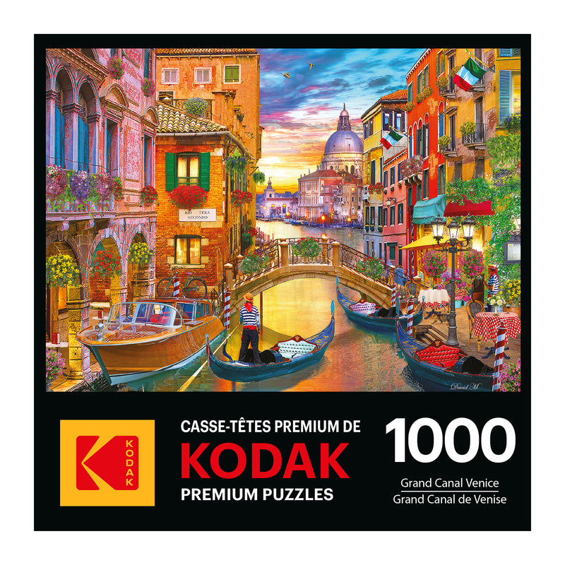 Explore Venice's beauty with the "ROSEART - KODAK PREMIUM - GRAND CANAL VENICE" 1000-piece jigsaw puzzle, showcasing gondolas on the Grand Canal among colorful buildings and a quaint bridge, offering a delightful challenge for puzzle lovers.
