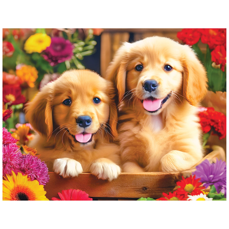 Two Golden Puppy Pals sit in a wooden box amid vibrant flowers, gazing at the camera—captured perfectly on the ROSEART - KODAK PREMIUM - GOLDEN PUPPY PALS 100 PIECE JIGSAW PUZZLE.