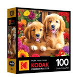 The ROSEART KODAK PREMIUM Golden Puppy Pals 100-piece jigsaw puzzle features two golden puppies among colorful flowers, with "Golden Puppy Pals" on the box front.