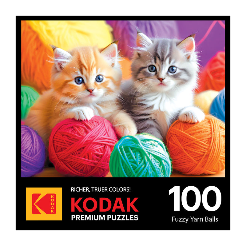 Two kittens sit among colorful fuzzy yarn balls in this charming scene on the ROSEART-KODAK PREMIUM "Fuzzy Yarn Balls" 100-piece jigsaw puzzle box.