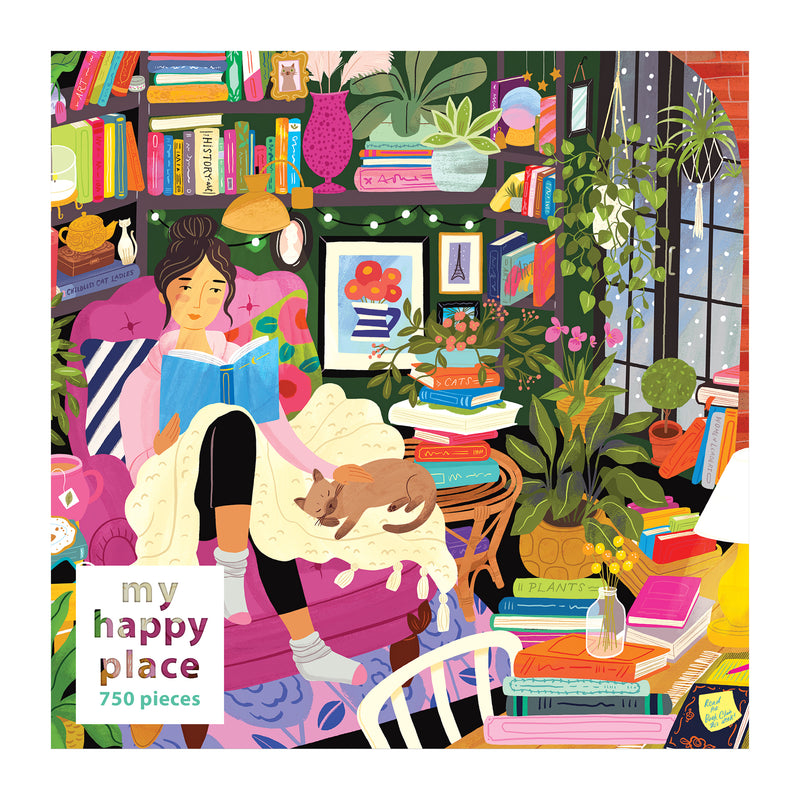 The ROSEART - MY HAPPY PLACE - READING NOOK - 750 PIECE JIGSAW PUZZLE depicts a woman in a cozy pink chair with a blanket and her cat, surrounded by books, plants, and string lights—ideal for those who love immersing in stories or completing jigsaw puzzles.