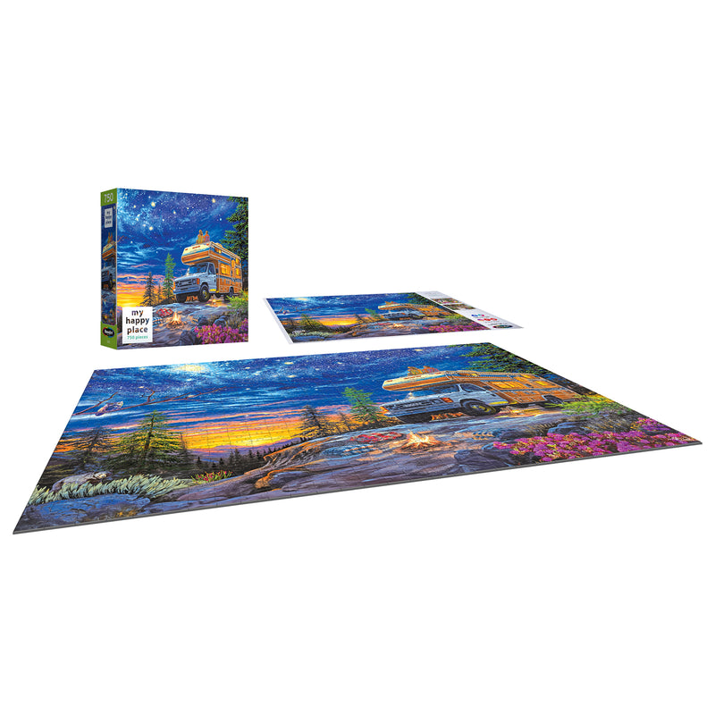 The ROSEART - MY HAPPY PLACE - CAMPER NIGHT 750-piece jigsaw puzzle features an RV at sunset in a scenic outdoor setting with trees and flowers, alongside the displayed puzzle box.