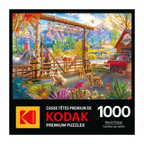 The ROSEART - KODAK PREMIUM jigsaw puzzle features a ranch scene with horses, dogs, and a pickup under a mountain backdrop. Labeled "Yellow Mountain Ranch," it contains 1000 pieces.