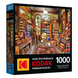 The ROSEART Kodak Premium jigsaw puzzle features a vivid 1000-piece image of a vintage haberdashery, brimming with various fabrics, hats, and accessories set against an intricately designed interior.