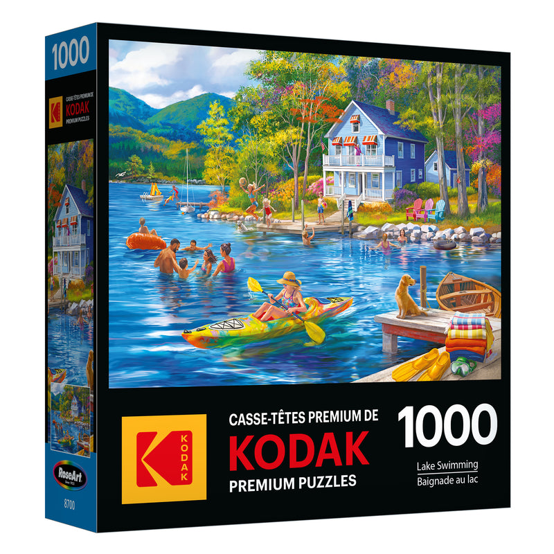 Immerse yourself in nature with the ROSEART - KODAK PREMIUM - LAKE SWIMMING - 1000 PIECE JIGSAW PUZZLE. This puzzle depicts people kayaking and swimming in a serene lake near a house, surrounded by lush trees and majestic mountains, ideal for lake swimming fans who love challenging puzzles.