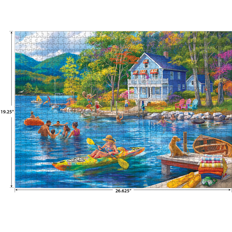The ROSEART KODAK PREMIUM Lake Swimming 1000 Piece Jigsaw Puzzle captures a picturesque scene: people swimming by a lakeside house, majestic mountains, colorful trees, and a dog on the dock with a kayak and blankets.