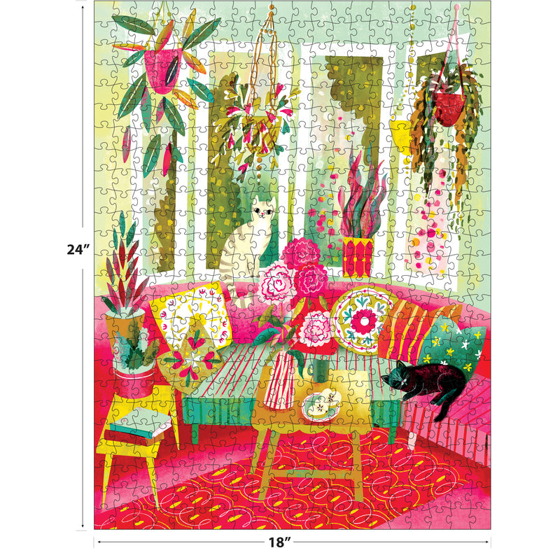 Relax with the ROSEART Double Sided Cozy Cats 500 Piece Jigsaw Puzzle (24" x 18"), featuring a vibrant, plant-filled living room, patterned furniture, and adorable cats—a white one on a chair and a black one on the sofa.