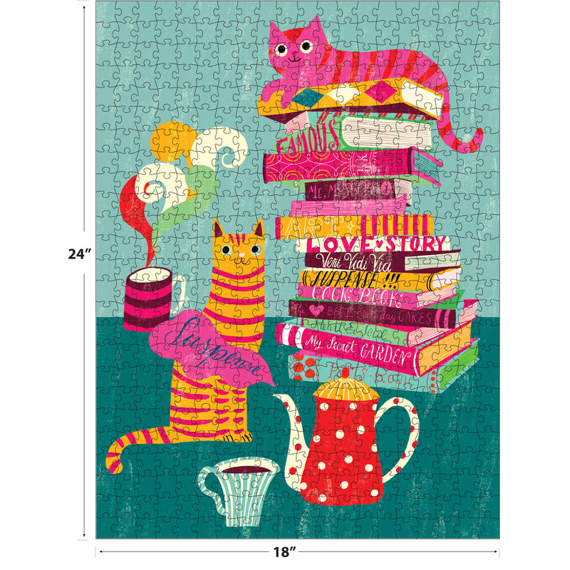 The ROSEART DOUBLE SIDED COZY CATS 500 piece jigsaw puzzle features cozy cats, books, a red polka-dot teapot, and steaming mug in a colorful illustration. Finished size: 24 x 18 inches.