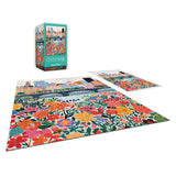 The completed ROSEART - VERTICAL VISIONS - CITY FLOWERS 500 piece jigsaw puzzle displays vibrant blooms, shown with its box and a matching image poster.