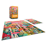 A completed ROSEART - VERTICAL VISIONS - MUSHROOMS - 500 PIECE JIGSAW PUZZLE, showing vibrant mushroom illustrations, is displayed with its box and reference image nearby.