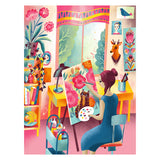 A woman in blue paints pink flowers and a black cat in a vibrant, plant-filled studio—captured in the ROSEART VERTICAL VISIONS ART STUDIO 500-piece jigsaw puzzle, where creativity blooms like a living masterpiece.