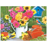A vibrant spring bouquet in a white pitcher, chirping birds, a birdhouse, potted plants, and a wooden cart sit on a garden table—a scene beautifully depicted in the 350-piece ROSEART KODAK PREMIUM SPRING BOUQUET WITH BIRDS jigsaw puzzle.