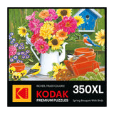 The puzzle box cover features a painted scene of vibrant flowers, a white watering can, and a red wheelbarrow with two birds. Text reads "Kodak Premium Puzzles, 350XL." It's perfect for enthusiasts as the ROSEART Kodak Premium Spring Bouquet with Birds 350-piece jigsaw puzzle.
