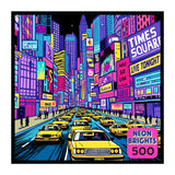 The ROSEART - NEON BRIGHTS - NYC - 500 PIECE JIGSAW PUZZLE features a vibrant Times Square night scene with yellow taxis, bustling pedestrians, and glowing neon billboards—perfect for cityscape and puzzle enthusiasts.