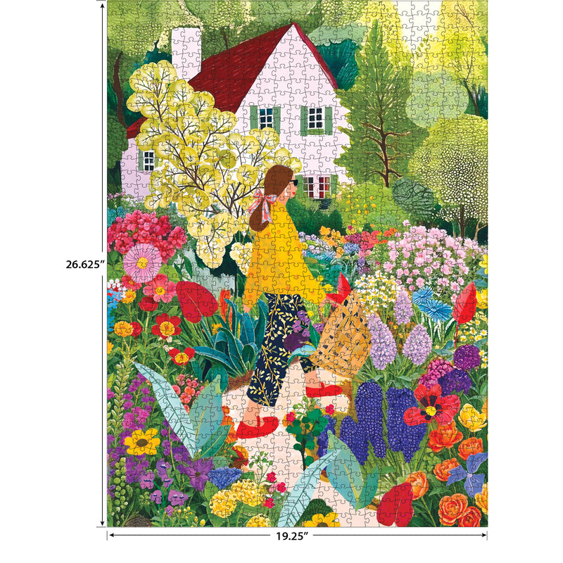 A woman in a yellow top pushes a wheelbarrow through a vibrant flower garden by a white house in the ROSEART Soft Touch Picking Flowers 1000 piece jigsaw puzzle, measuring 26.625" x 19.25".