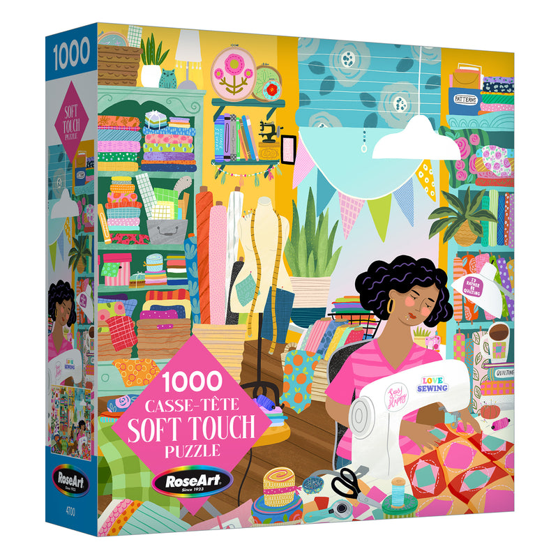 ROSEART - SOFT TOUCH SEWING ROOM 1000 PIECE JIGSAW PUZZLE features a colorful illustration of a woman sewing, surrounded by plants, fabrics, and quilting supplies—perfect for craft and puzzle enthusiasts.