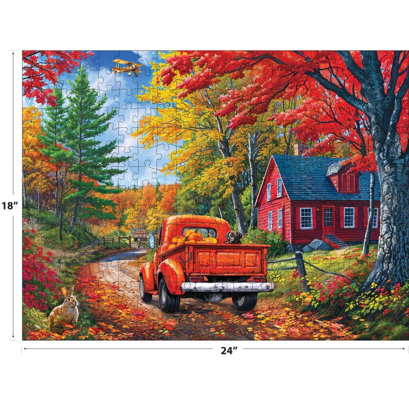 The completed ROSEART KODAK PREMIUM MAINE ROAD 350-piece jigsaw puzzle (24x18 in) features a red truck on a country road near a red house, with autumn trees, a rabbit, dog, and airplane in the sky.